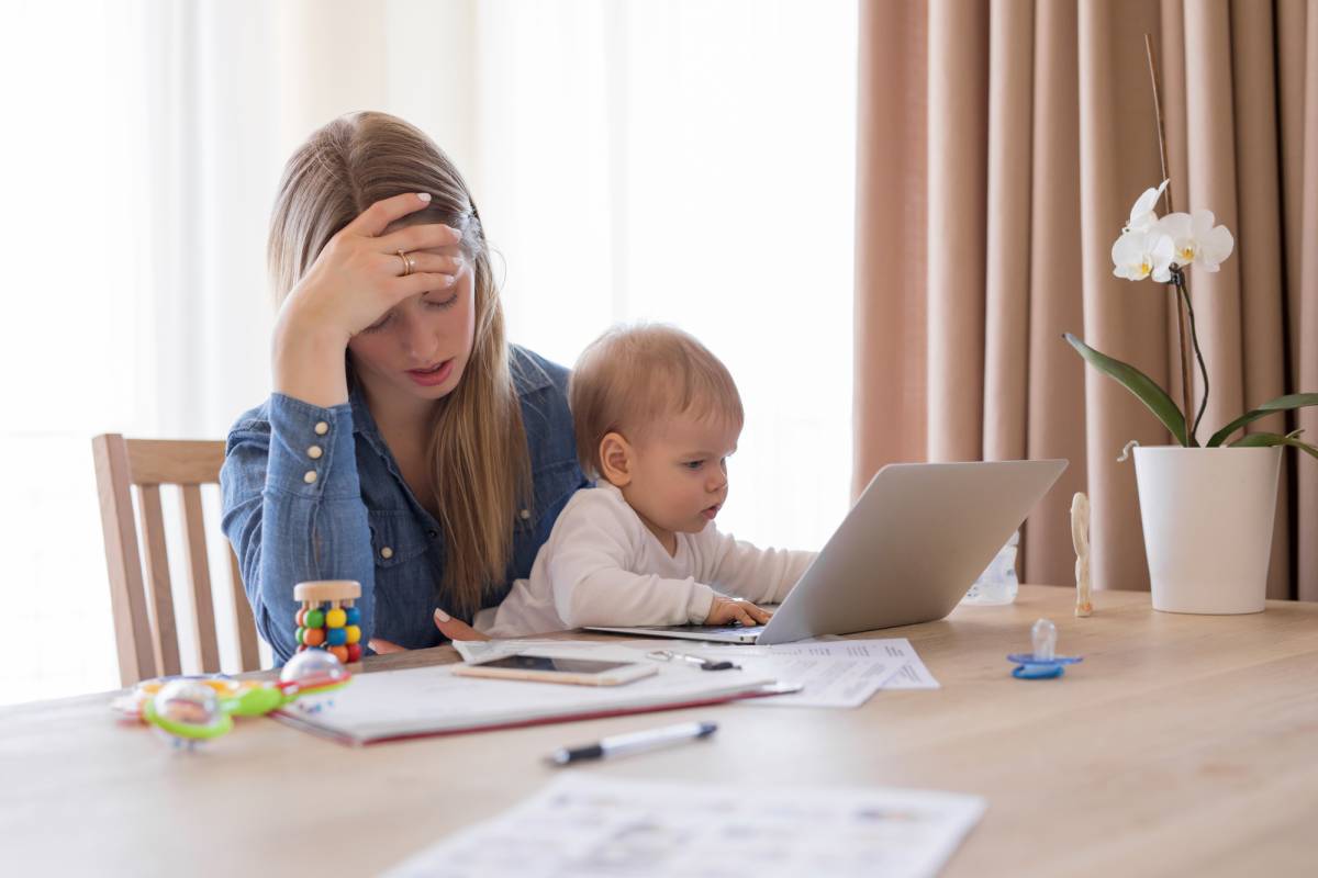 mother with baby stressed by finances